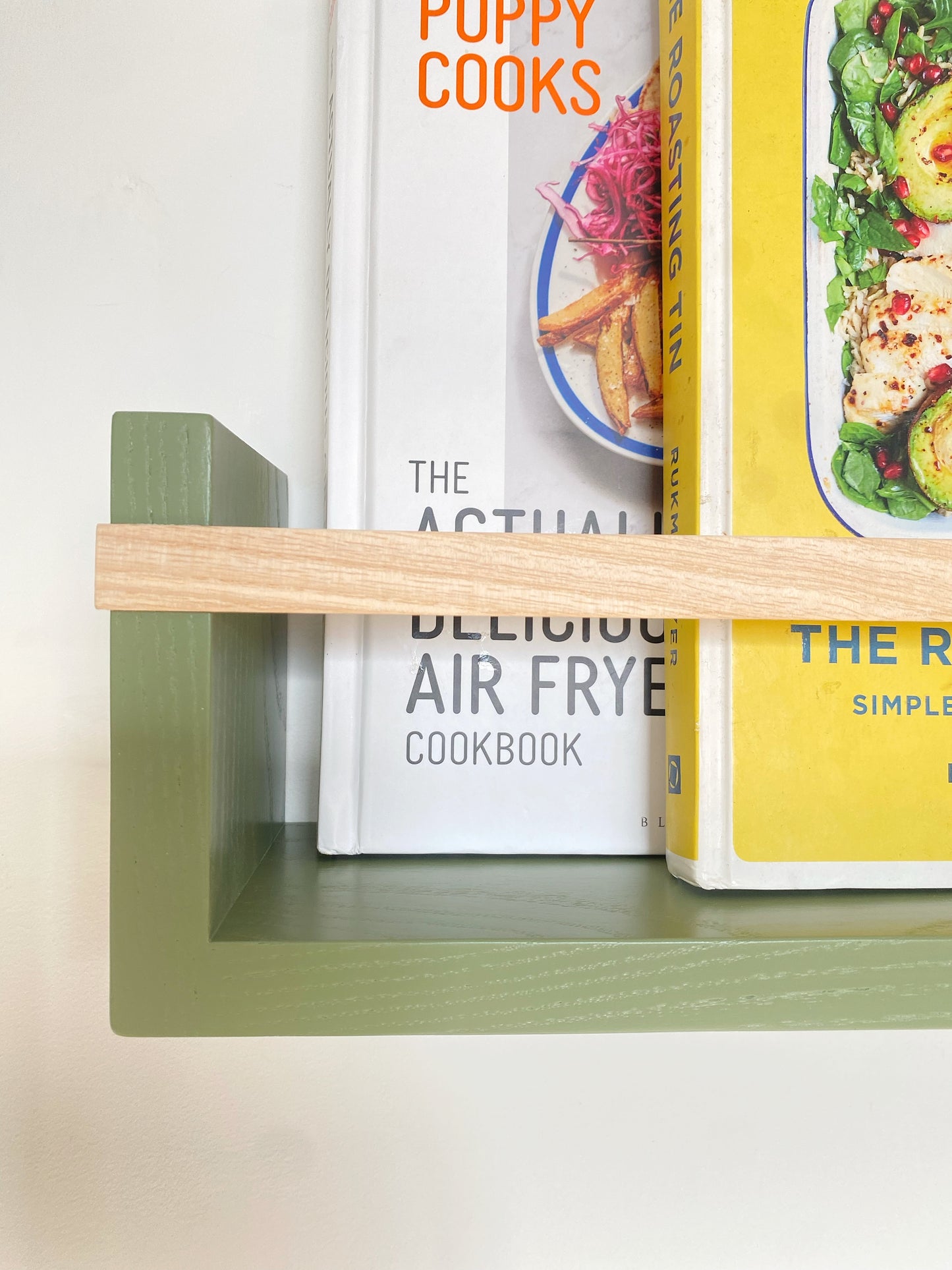 Close-up of Colour Pop Bookshelf bar – natural Ash wood with matte paint contrast - Olive