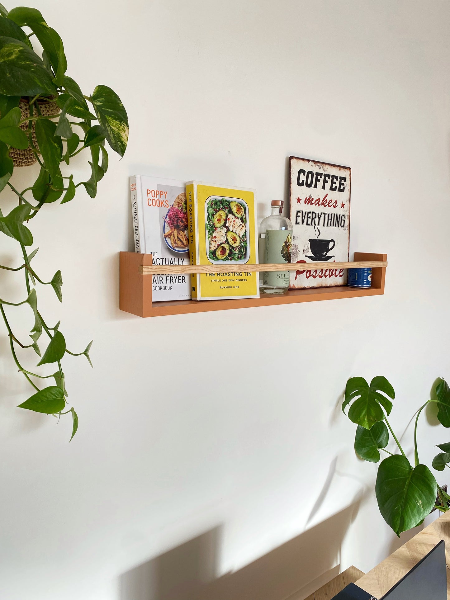 Close-up of Colour Pop Bookshelf bar – natural Ash wood with matte paint contrast